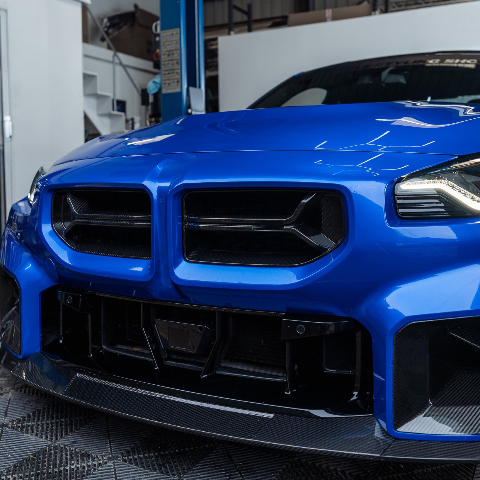 Blue BMW M2 with carbon fibre front parts