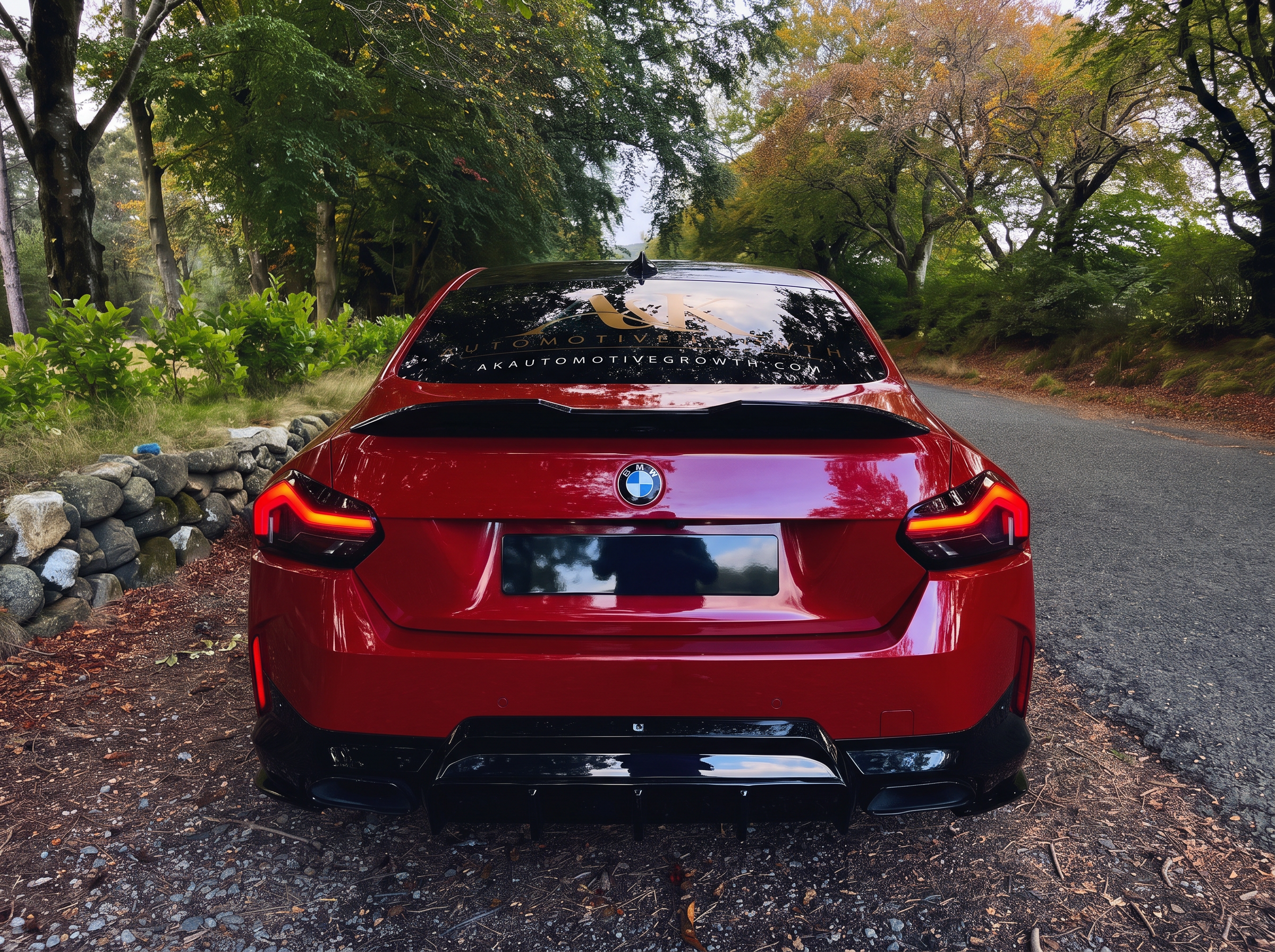 Red BMW in A&K Automotive Growth livery